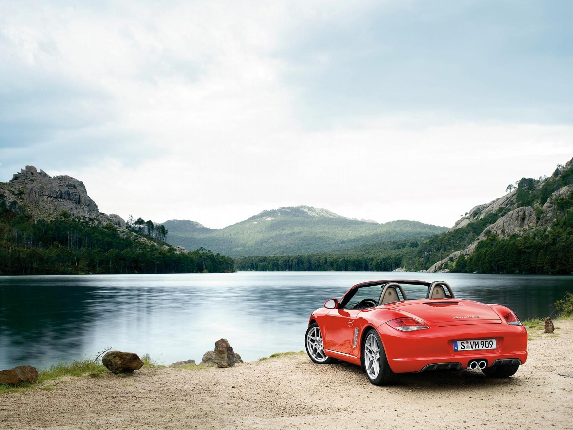 Воды аренда автомобилей. Порше Бокстер красный. Озеро Комо и Порше 911. Porsche 911. Porsche Boxster 2002 красный.